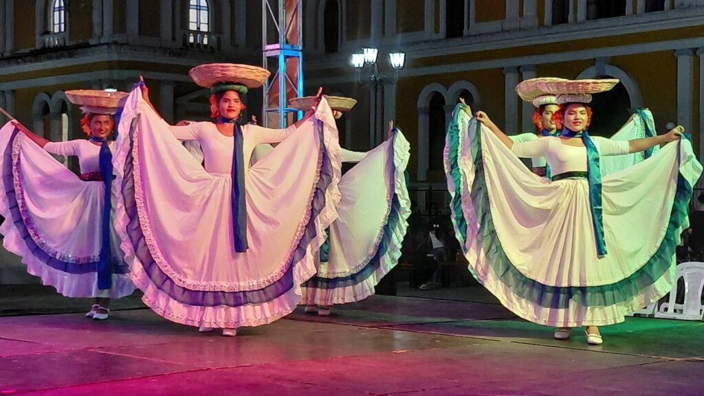 Group of young women dancing Nicaraguan folklore during the Latidos en Movimiento Cultural Gala at Guadalupe Church Plaza in Granada Nicaragua
